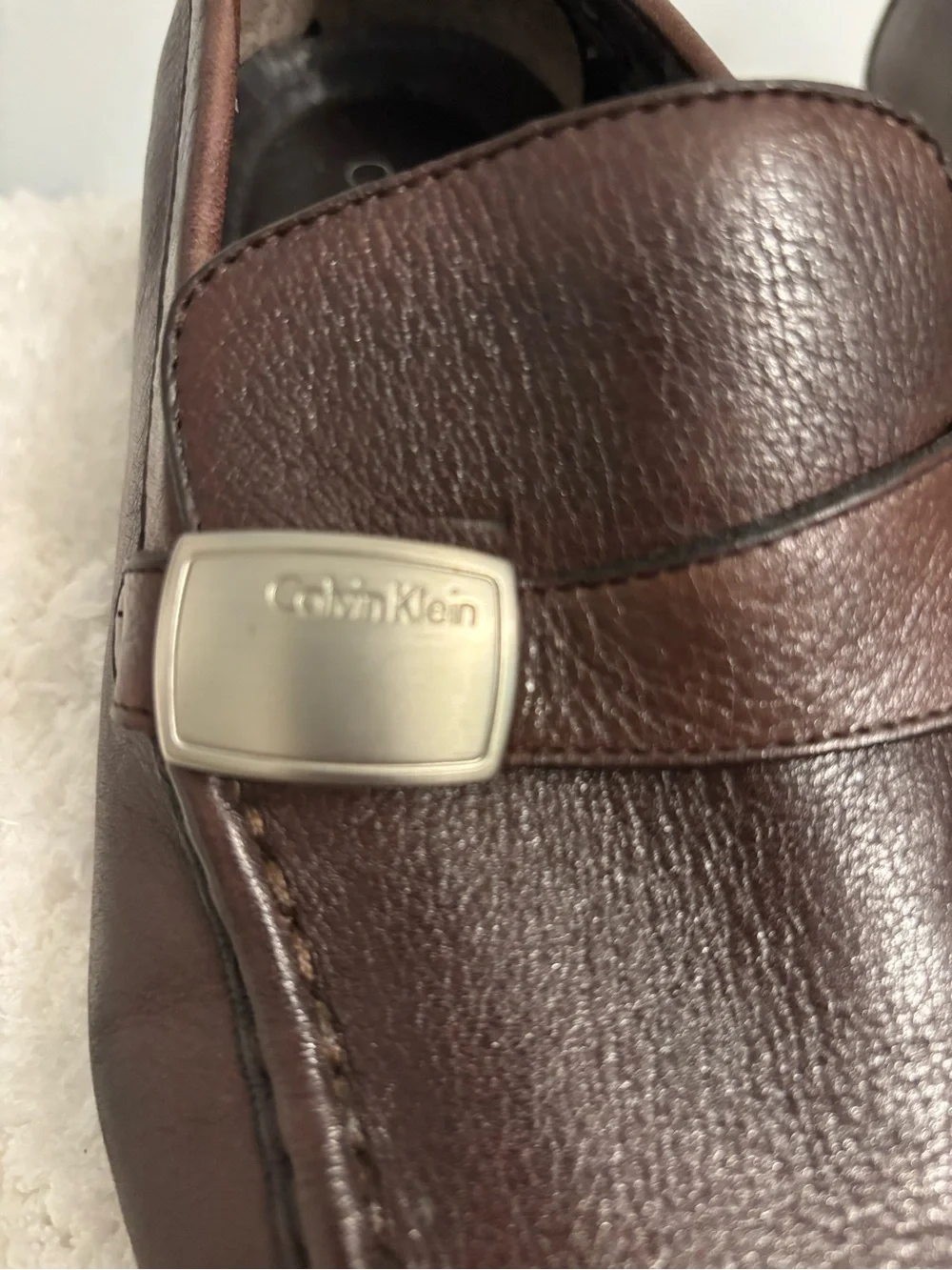 Calvin Klein Men's Dark Brown Leather Slip-Ons with Silver Logo Accent